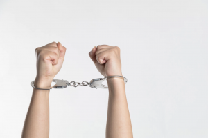 Picture of hands in handcuffs.