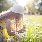 little girl picking flowers